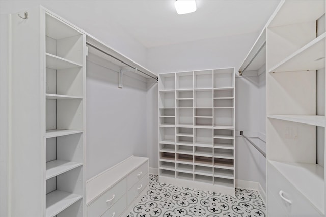 spacious closet featuring light tile patterned floors