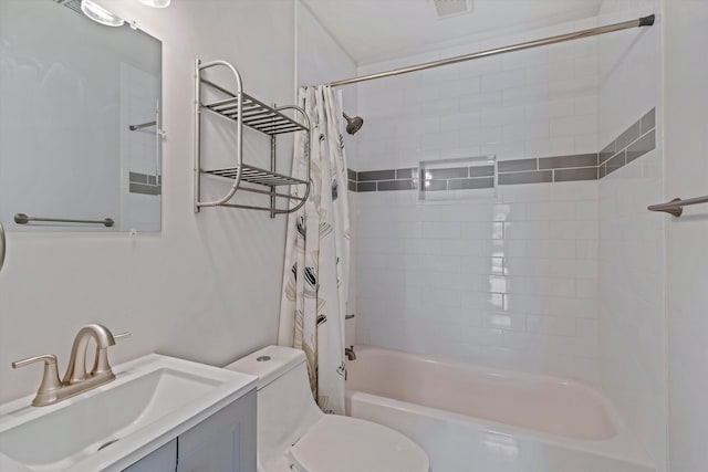 bathroom featuring visible vents, vanity, toilet, and shower / tub combo