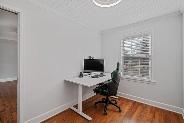 office area featuring crown molding, baseboards, and hardwood / wood-style floors