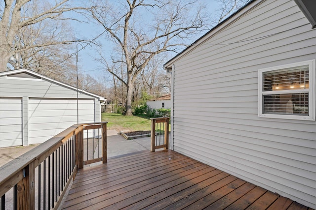 wooden deck featuring an outbuilding and a lawn