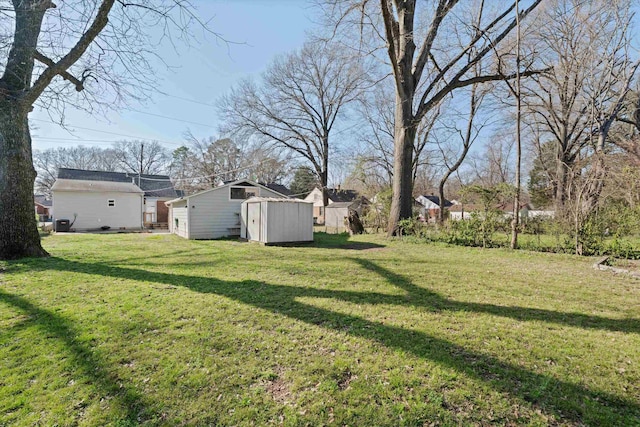 view of yard featuring an outbuilding and a storage unit