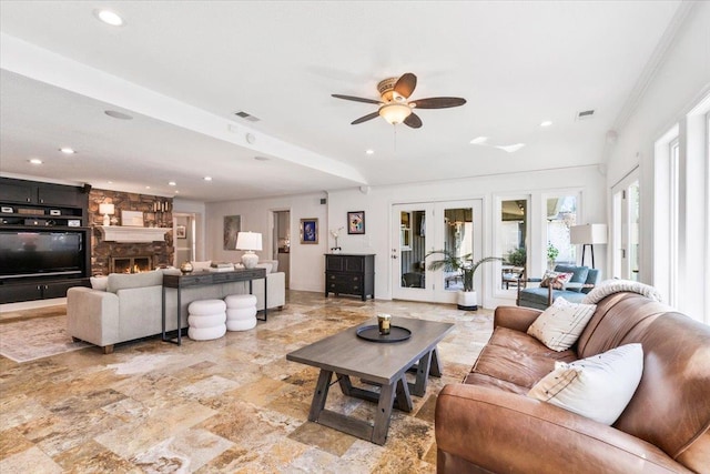 living room featuring a fireplace, visible vents, french doors, and ceiling fan