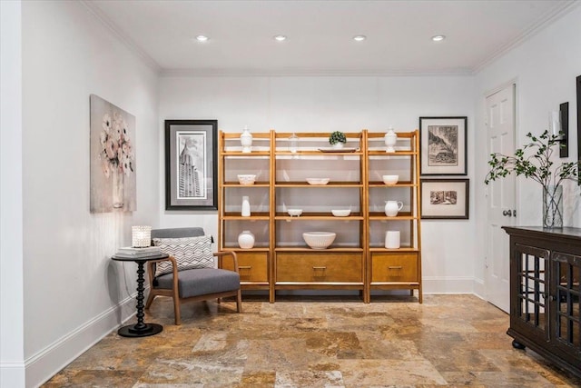 living area with recessed lighting, baseboards, crown molding, and stone finish floor