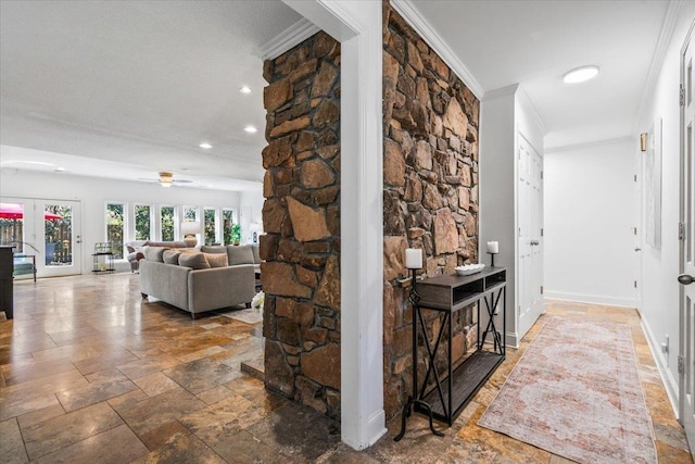 hall with stone finish flooring, recessed lighting, baseboards, and ornamental molding