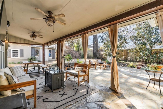 view of patio / terrace featuring a ceiling fan, outdoor lounge area, and fence