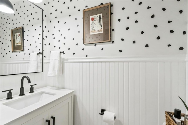 bathroom with vanity and wainscoting