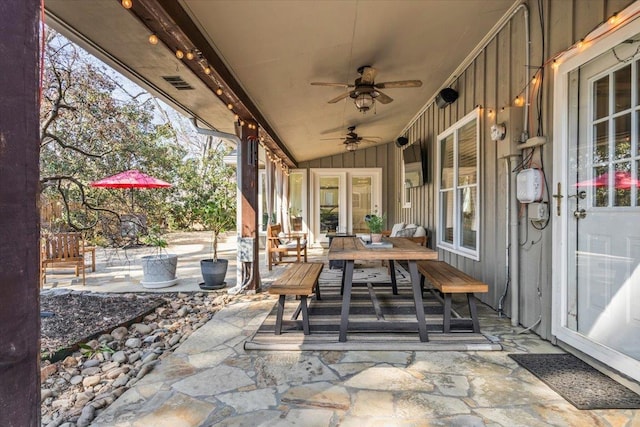 view of patio with visible vents, ceiling fan, and outdoor dining space