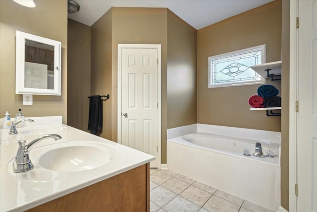 full bath with tile patterned flooring, a garden tub, double vanity, and a sink