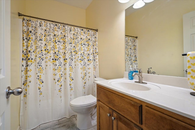 bathroom featuring vanity, toilet, and a shower with curtain