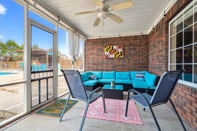 sunroom / solarium with ceiling fan