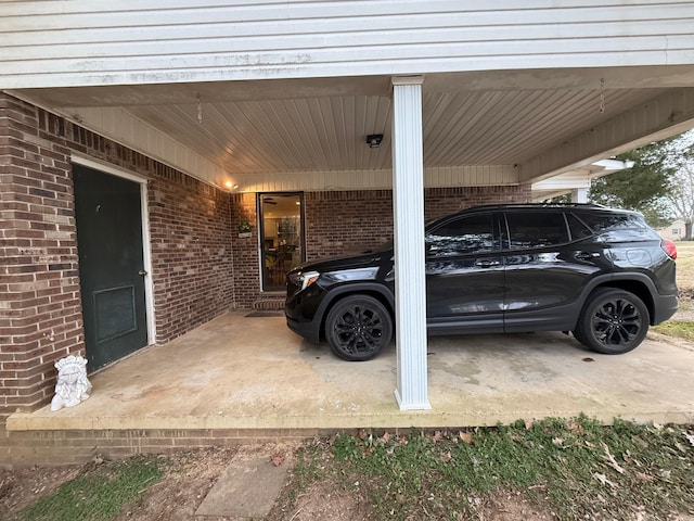 view of parking / parking lot featuring an attached carport