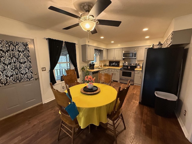 dining area featuring dark wood-style floors, recessed lighting, baseboards, and ceiling fan