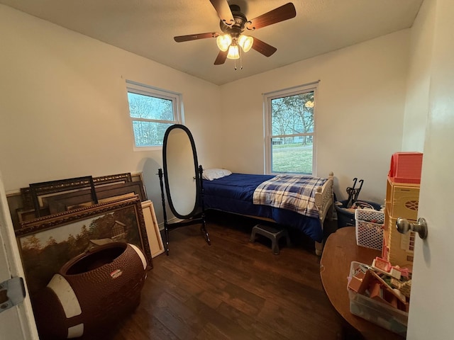 bedroom featuring a ceiling fan and wood finished floors