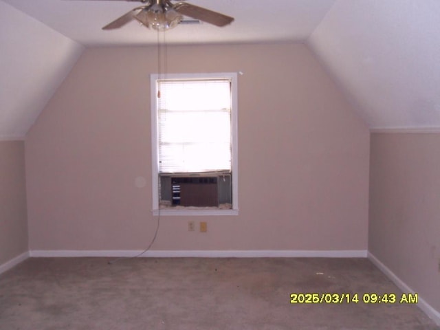 additional living space featuring lofted ceiling, cooling unit, carpet floors, baseboards, and ceiling fan