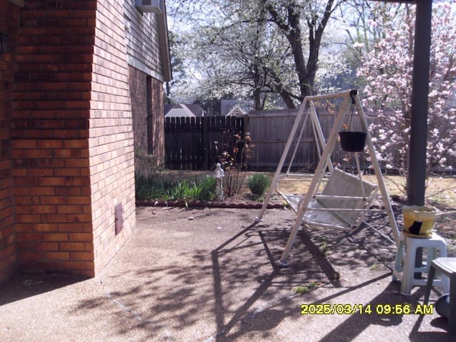 view of patio / terrace featuring fence