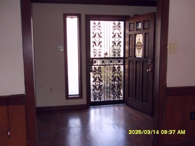 foyer entrance with wood finished floors