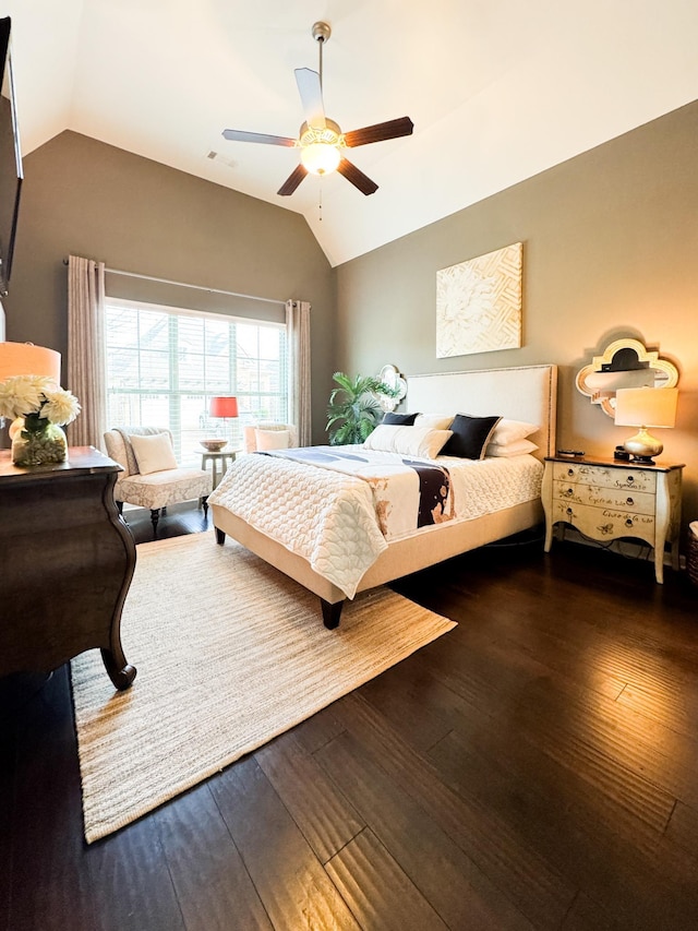 bedroom with hardwood / wood-style flooring, a ceiling fan, and vaulted ceiling