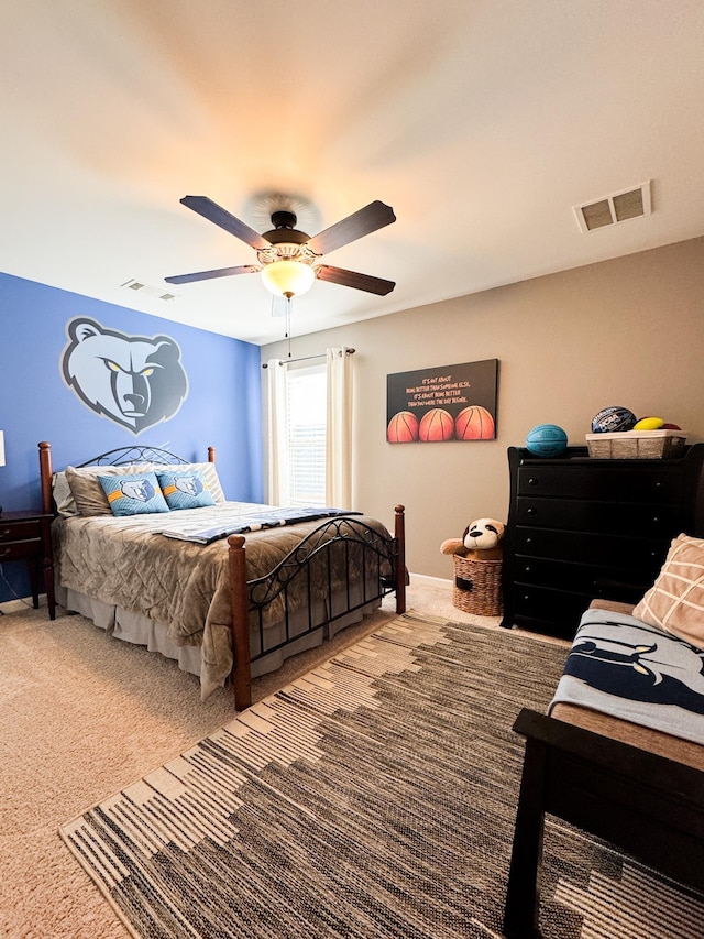 bedroom featuring visible vents, baseboards, a ceiling fan, and carpet flooring