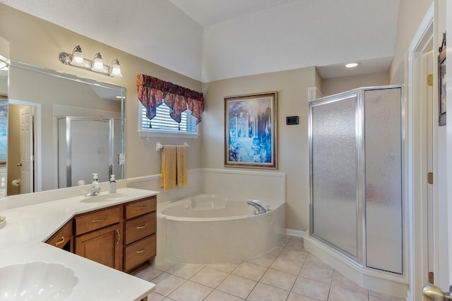 bathroom featuring vanity, tile patterned floors, a garden tub, and a stall shower