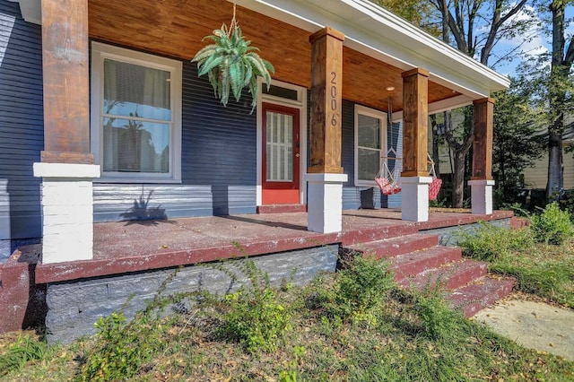 entrance to property featuring covered porch