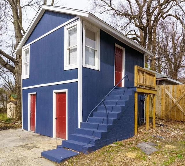 exterior space with stairs and fence