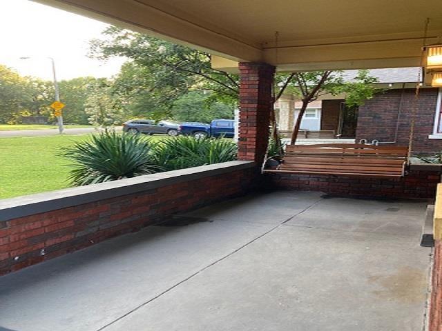 view of patio featuring a porch