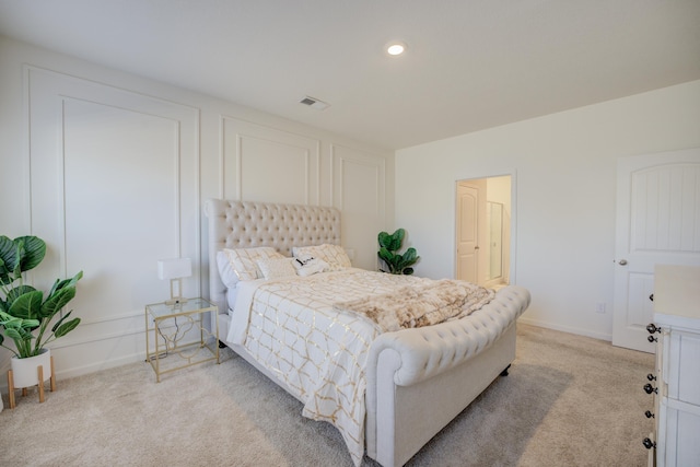 bedroom with recessed lighting, visible vents, baseboards, and light colored carpet