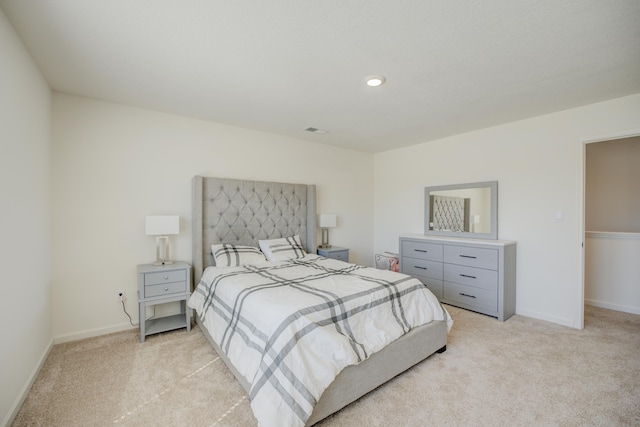 bedroom with recessed lighting, visible vents, light colored carpet, and baseboards