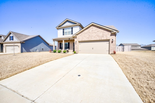 view of front of home with brick siding, an attached garage, and concrete driveway