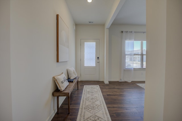 foyer entrance with recessed lighting, baseboards, and dark wood-type flooring