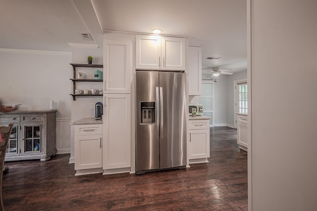 kitchen featuring open shelves, visible vents, stainless steel fridge with ice dispenser, and white cabinetry