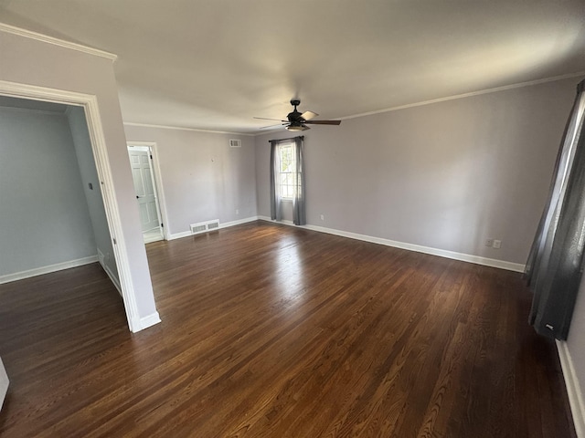 empty room featuring visible vents, crown molding, a ceiling fan, and dark wood-style flooring