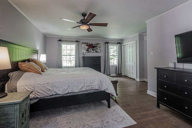 bedroom with baseboards, dark wood-style floors, a ceiling fan, and ornamental molding