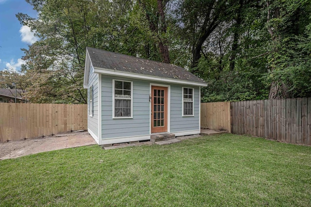 view of outbuilding featuring an outbuilding and a fenced backyard