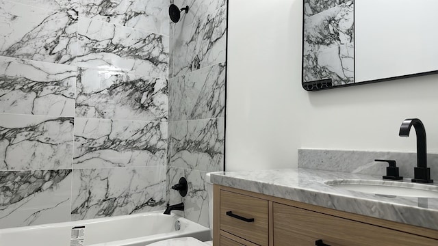 full bath featuring vanity and washtub / shower combination