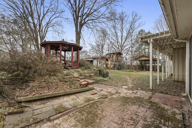 view of yard featuring a gazebo and a patio