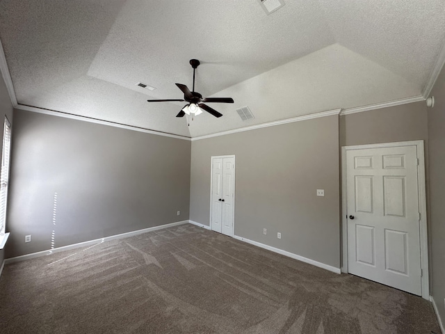 unfurnished bedroom with crown molding, visible vents, and lofted ceiling