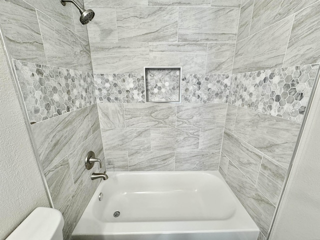 full bathroom featuring toilet and washtub / shower combination