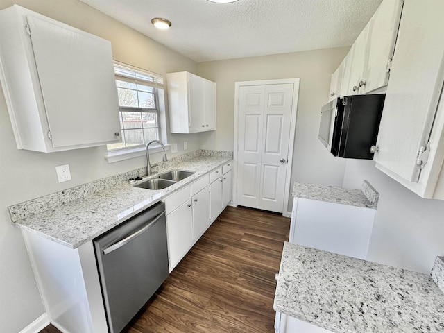 kitchen with dark wood-type flooring, a sink, a textured ceiling, white cabinets, and dishwasher