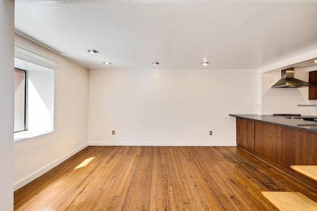 interior space with baseboards and hardwood / wood-style flooring