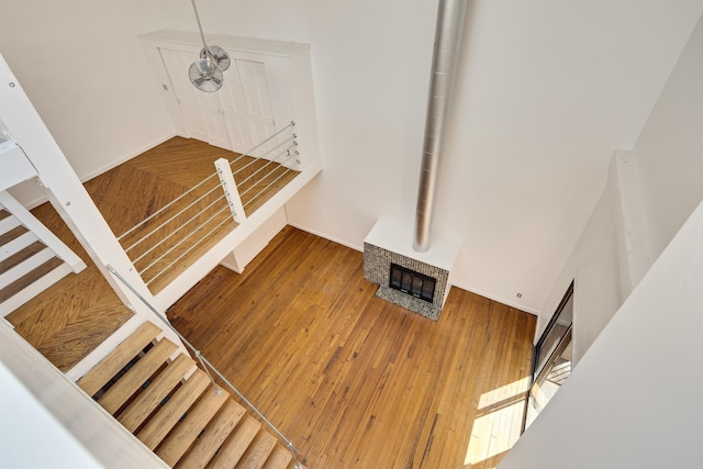 interior details featuring a fireplace and wood finished floors