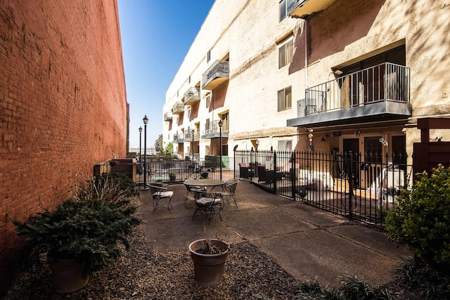 view of patio featuring fence