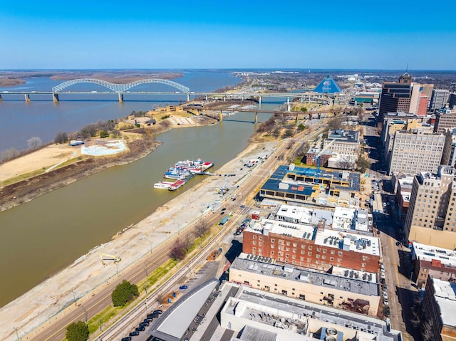 birds eye view of property with a view of city and a water view