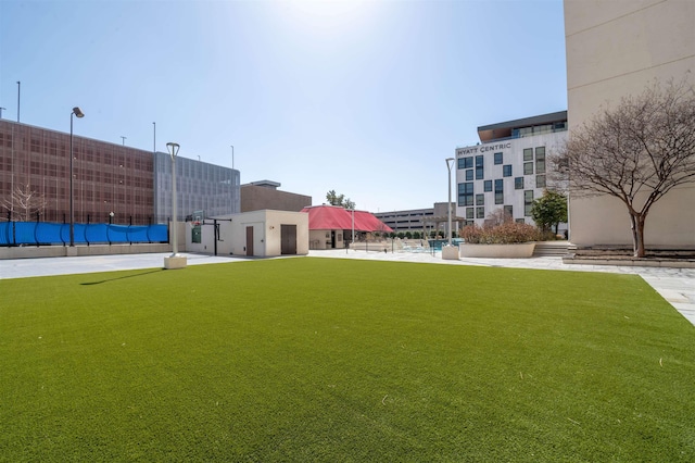 view of home's community featuring a lawn