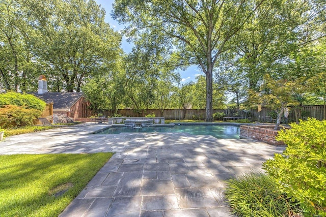 view of swimming pool with a fenced in pool, a lawn, a fenced backyard, and a patio area