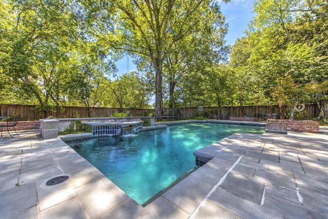 view of pool with a fenced backyard and a patio