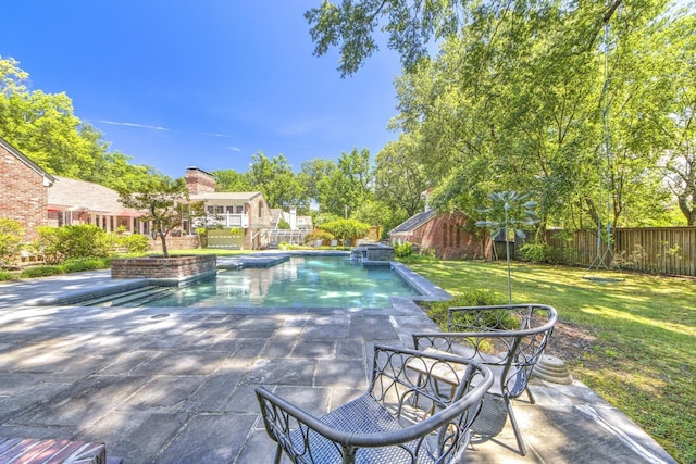 view of pool featuring a patio area, a lawn, a fenced backyard, and a fenced in pool