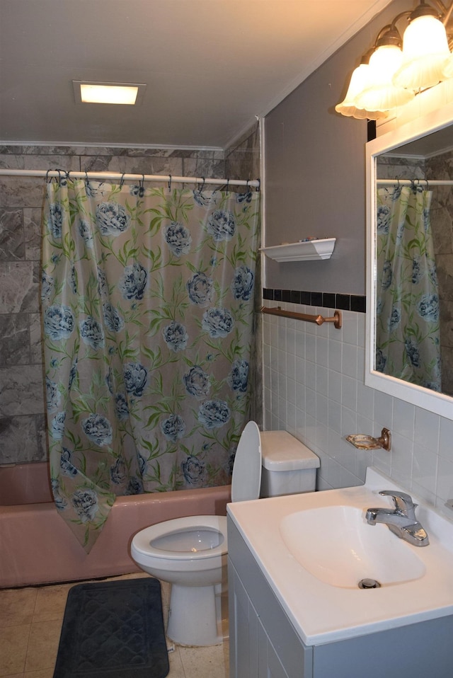 bathroom with tile patterned floors, toilet, tile walls, and shower / bath combo