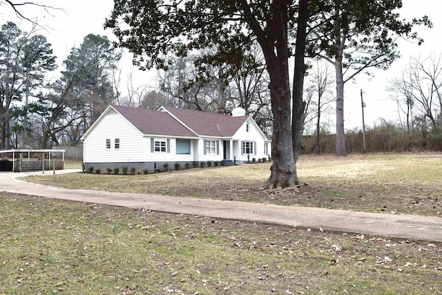 view of front of property with a front lawn and a chimney