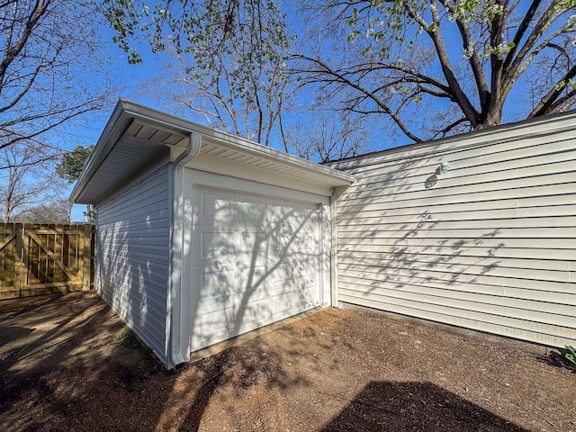 garage with fence